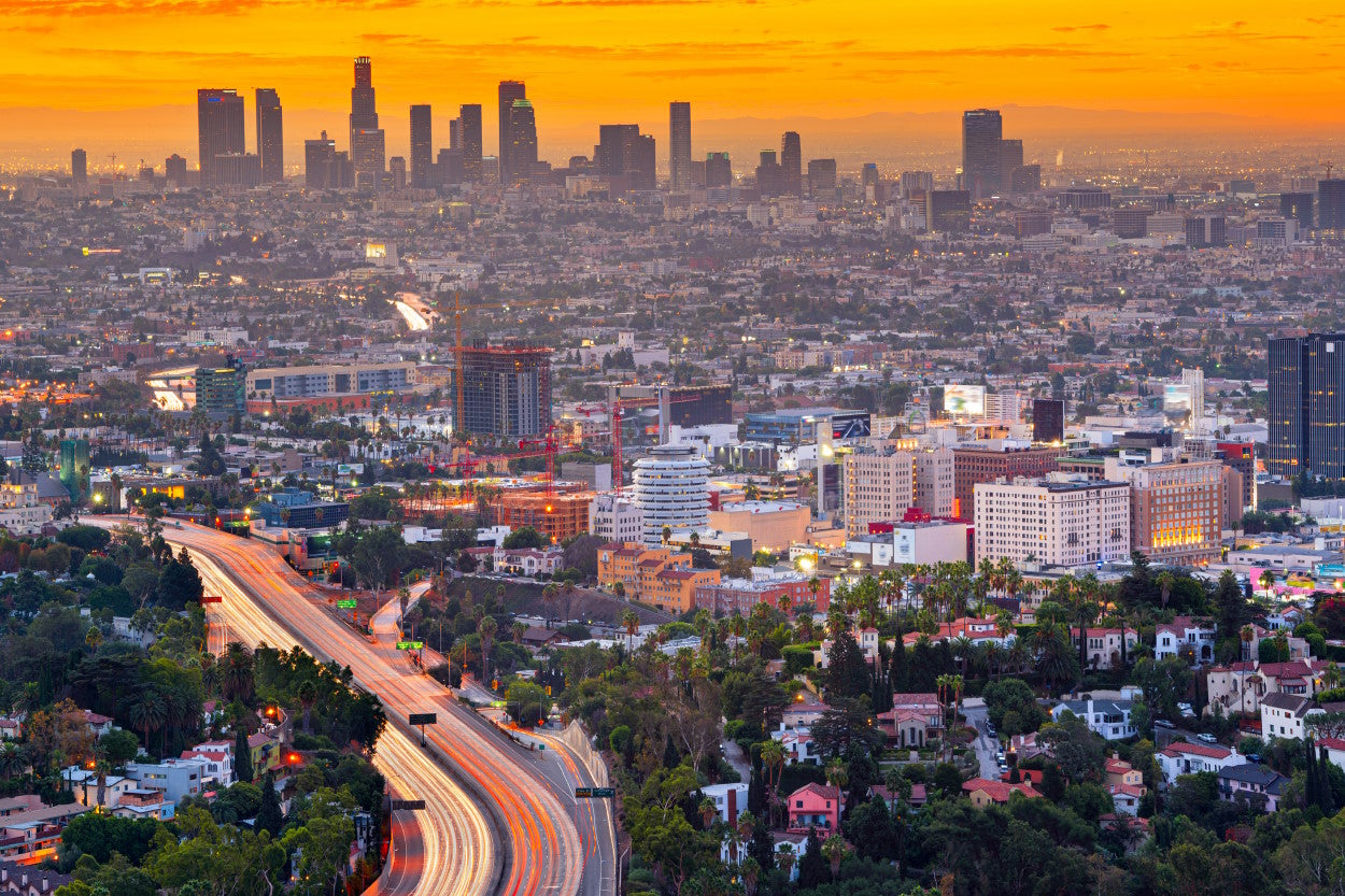 Aerial view of cityscape with an orange smoggy sky