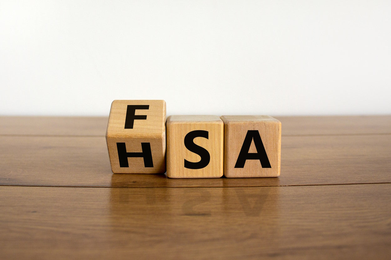 Wooden letter blocks spelling out 'HSA' and 'FSA'