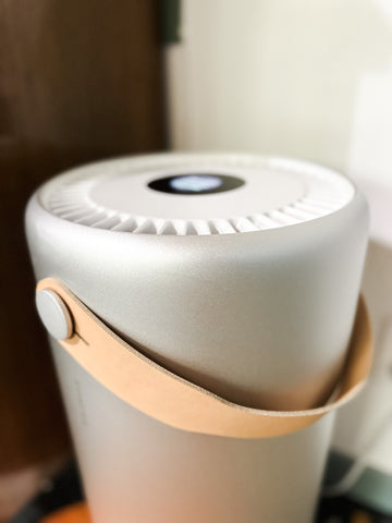 Close up of a sleek, gray metal Molekule Air Pro Air Purifier