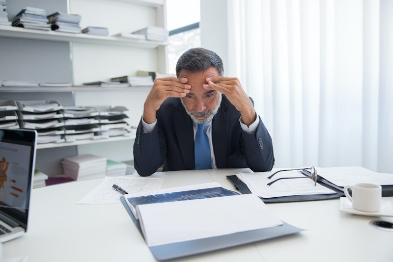 Man stressed at desk