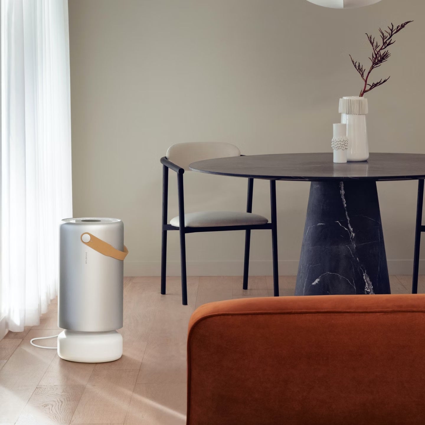 Molekule Air Pro air purifier on the floor next to dining room table