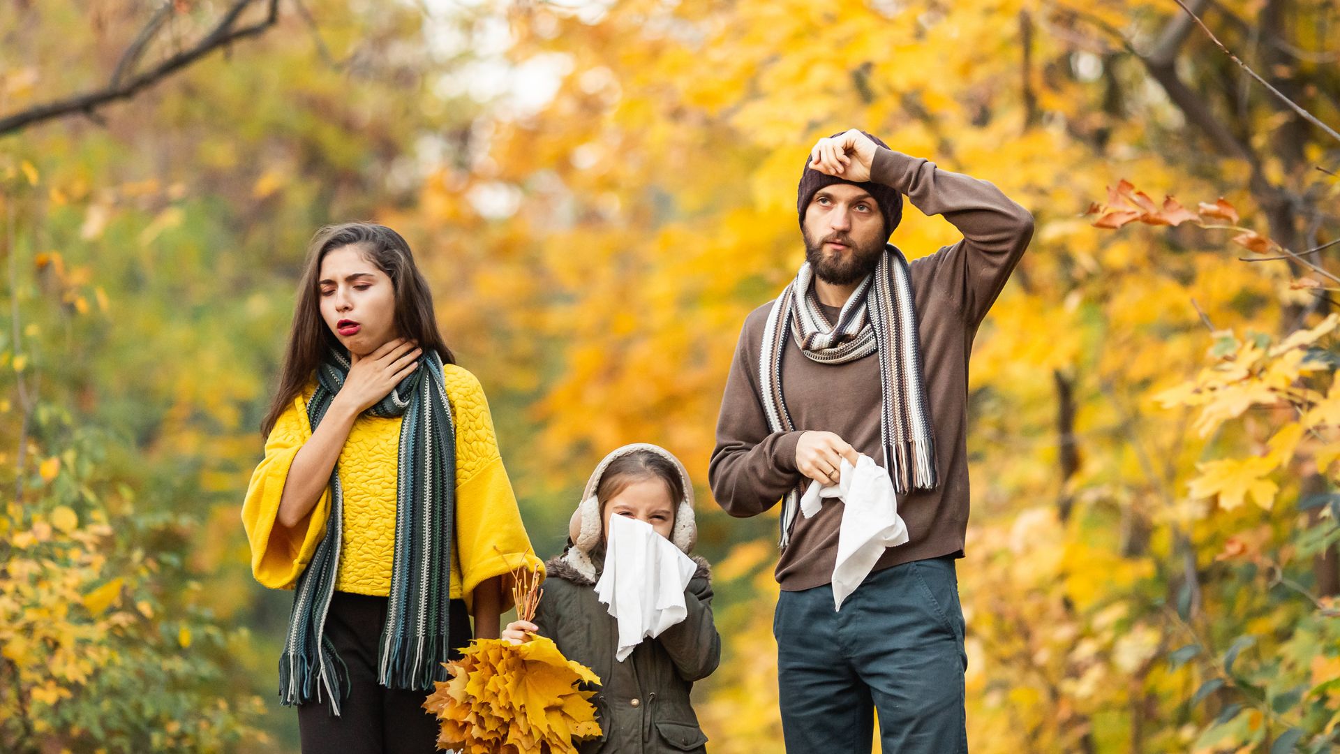 Family suffering from allergies outside