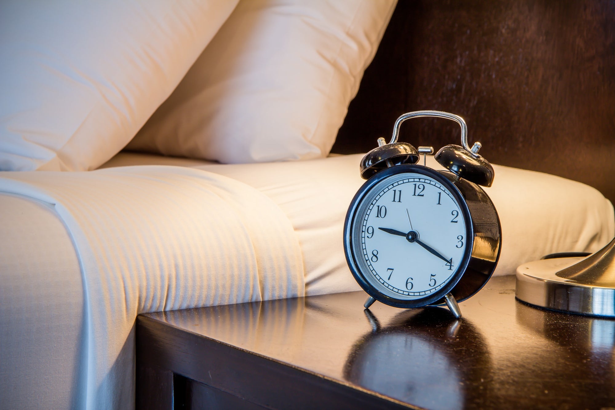 clock on bedside table at night