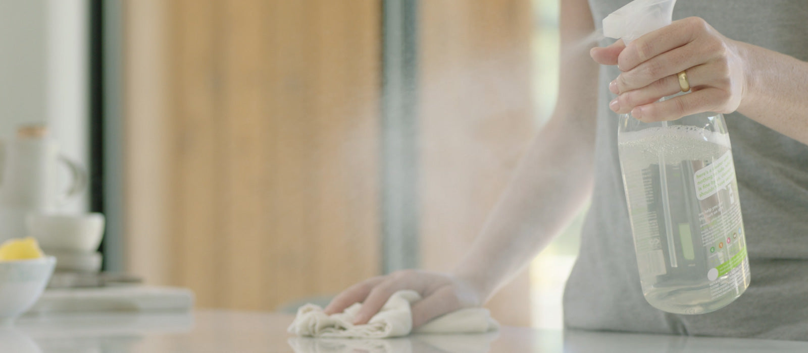 A hand spraying a cleaner